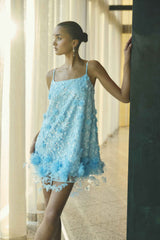 Brunette model wearing the Rina Embellished Shift Mini Dress in Blue campaign shot