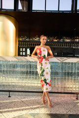 Brunette model wearing Solara Strapless Midi Dress in Pink Floral campaign shot 