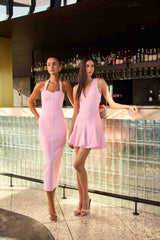 Brunette model wearing Marla Halter Gown in Pink campaign shot 