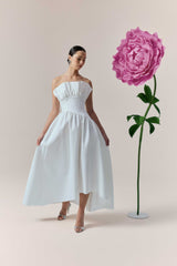 Brunette model wearing the Laurel Sleeveless Maxi Dress In White campaign shot 