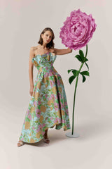 Brunette model wearing the Laurel Sleeveless Maxi Dress in Green Floral campaign shot