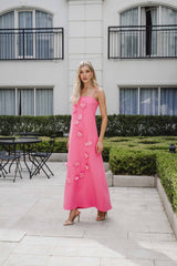 Blonde model wearing the Nolana Floral Applique Gown in Pink camnpaign shot 