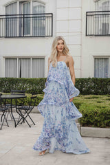 Blonde female model wears the Armani Tiered Maxi Gown in Baby Blue in courtyard