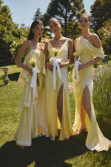 Brunette model wearing the Isadora Off The Shoulder Gown in Butter campaign shot 