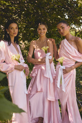 Brunette model wearing the Isadora Off The Shoulder Gown in Pale Pink campaign shot