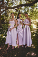 Brunette model wearing the Ruelle A-Line Maxi Dress in Purple campaign shot 