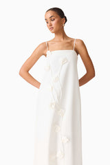 Brunette model wearing Nolana Floral Applique Gown in White close up posed shot
