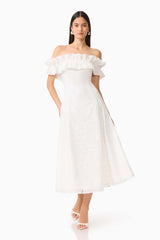 CURAAE Elen Off Shoulder Midi Dress in white with frill off shoulder detailing and lace fabrication posed shot