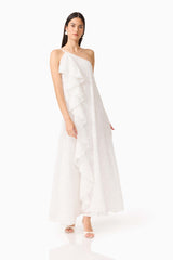 CURAAE Elen Ruffle Maxi Dress in White with ruffle detailing and asymmetric neckline posed side shot