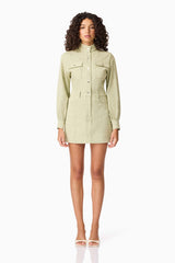 Brunette model wearing CURAAE Gretal Long Sleeve Mini Dress in Green front shot