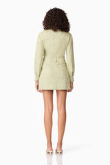 Brunette model wearing CURAAE Gretal Long Sleeve Mini Dress in Green back shot