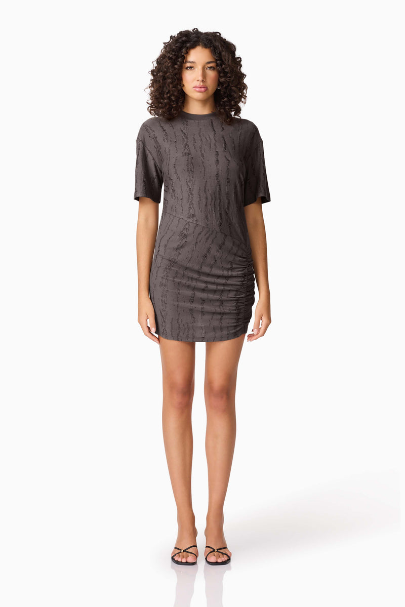 Brunette model wearing CURAAE Lavania Short Sleeve Mini Dress in Grey front shot