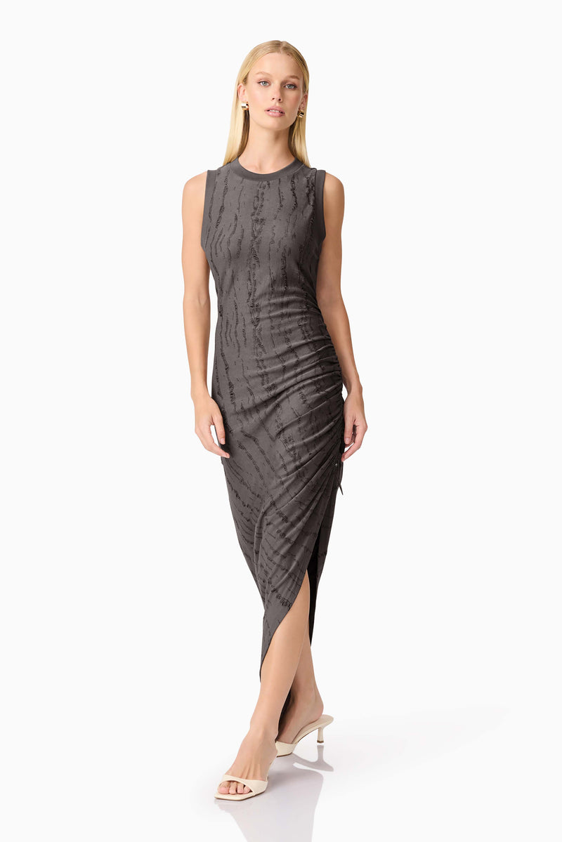 Blonde model wearing CURAAE Lavania Asymmetrical Midi Dress in Grey posed shot