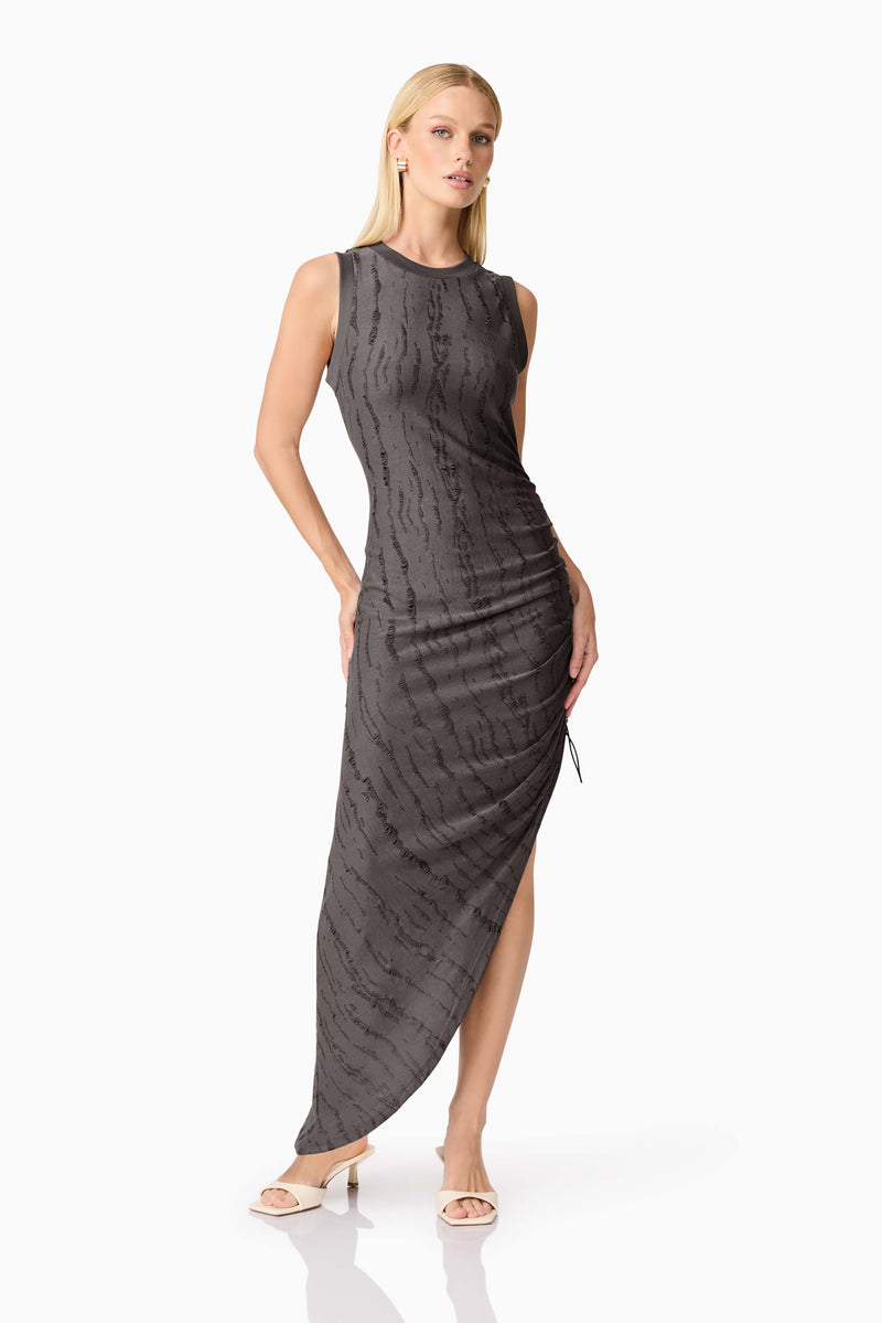Blonde model wearing CURAAE Lavania Asymmetrical Midi Dress in Grey posed hand on hip shot