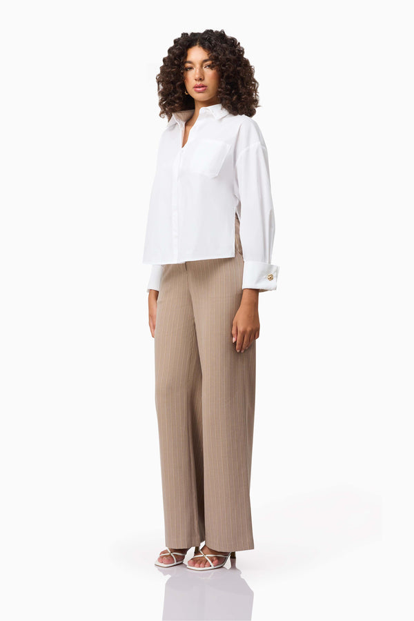 Brunette model wearing the Belle Shirt in White side shot