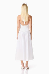 Blonde model wearing the Belle Halter Midi Dress in White back shot