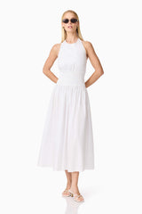 Blonde model wearing the Belle Halter Midi Dress in White posed shot
