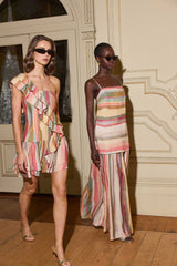 Model wearing CURAAE Zala Ruffle Mini Dress in Striped Multi with ruffles to evening party