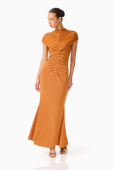 CURAAE Roya Maxi Dress in Caramel Brown with cap sleeves and front gathering looking away posed shot