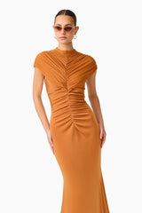 CURAAE Roya Maxi Dress in Caramel Brown with cap sleeves and front gathering close up hands on hips shot