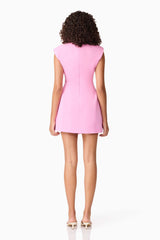 Brunette model wearing CURAAE Cariss Sleeveless Mini Dress in Pink back shot
