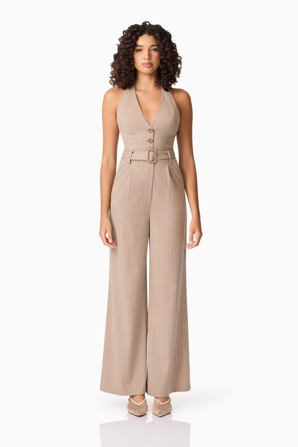 Brunette model wearing Orlena Jumpsuit in Beige Stripe front shot