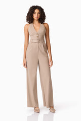Brunette model wearing Orlena Jumpsuit in Beige Stripe posed shot