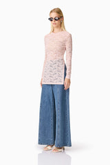 Blonde model wearing CURAAE Armelle Long Sleeve Top in Pink side shot