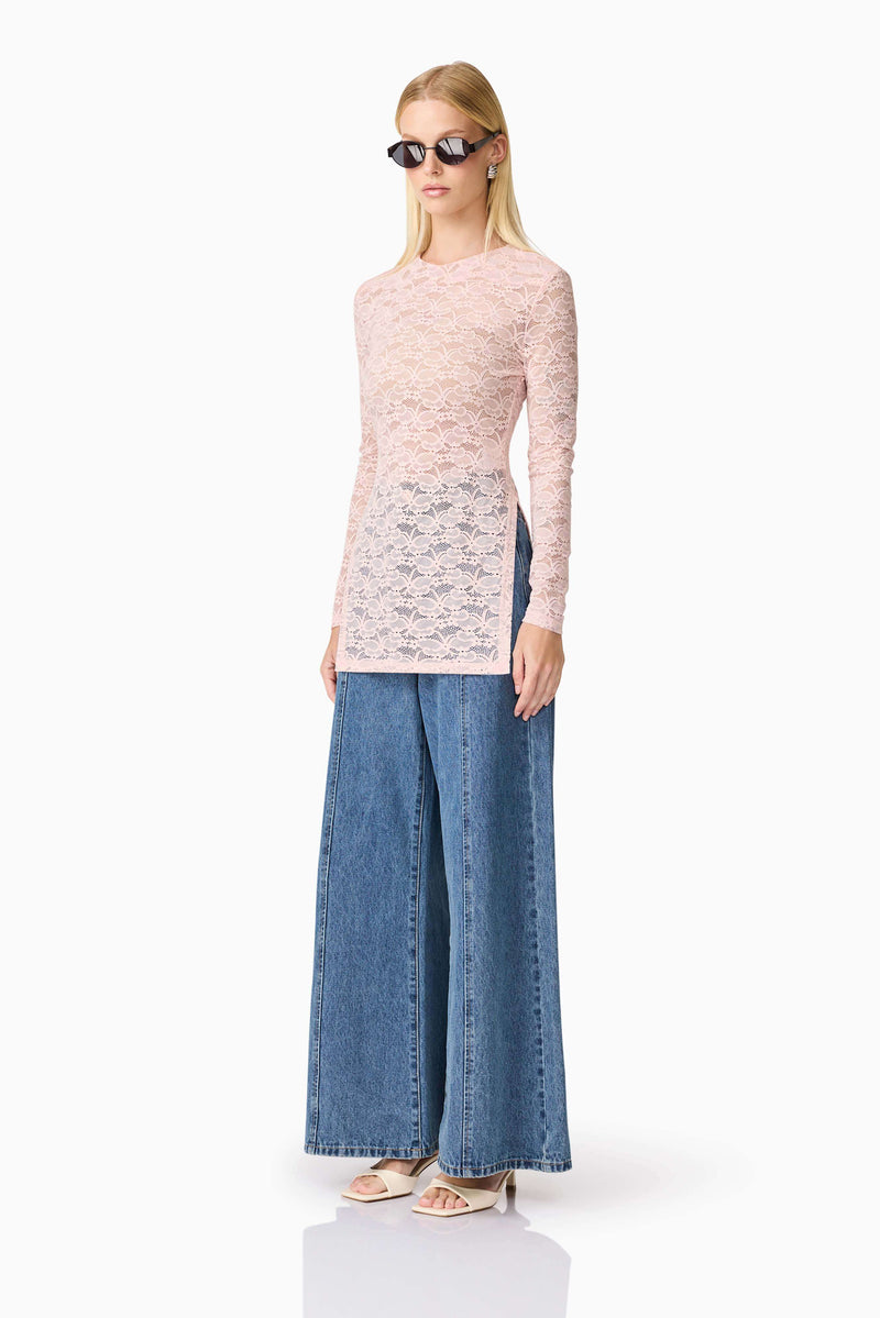 Blonde model wearing CURAAE Armelle Long Sleeve Top in Pink side shot