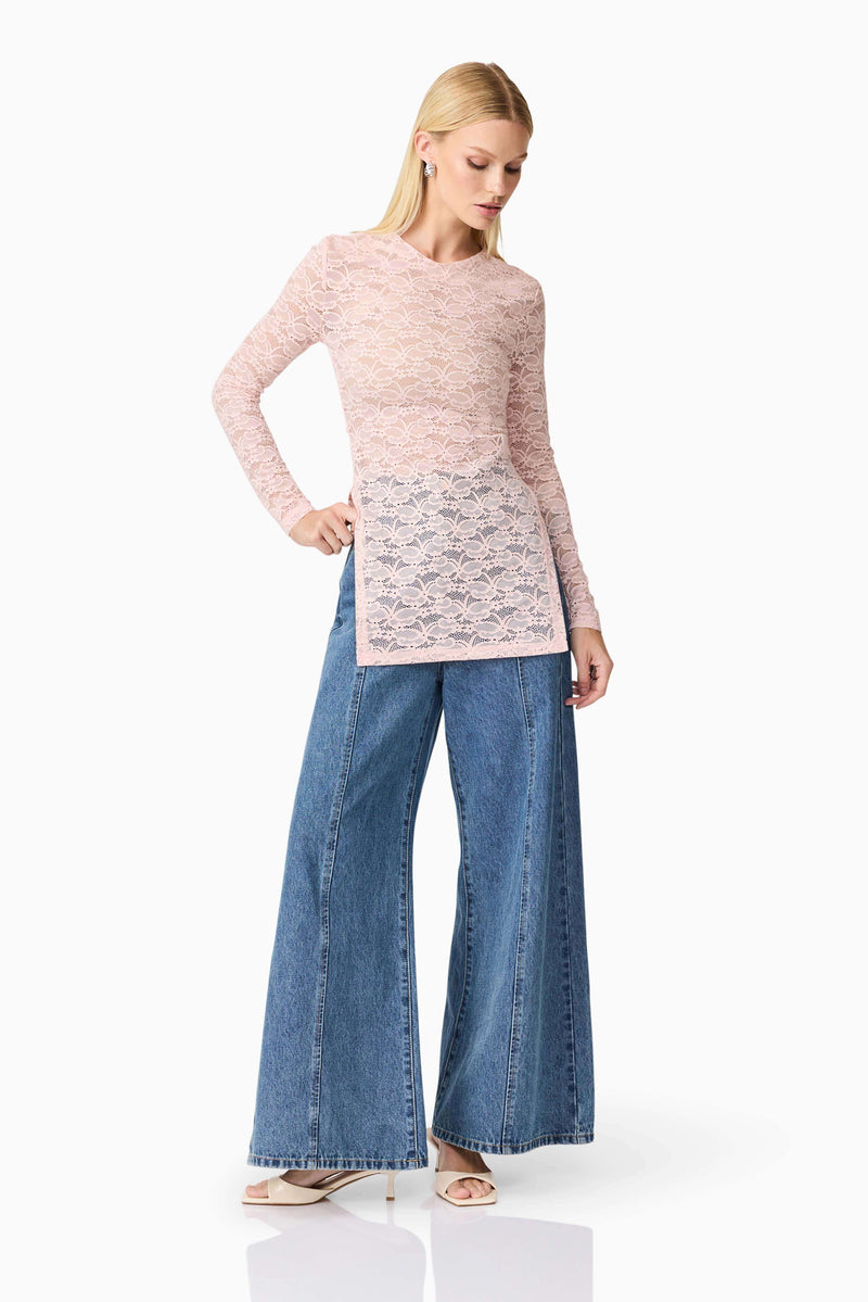 Blonde model wearing CURAAE Armelle Long Sleeve Top in Pink posed looking down shot