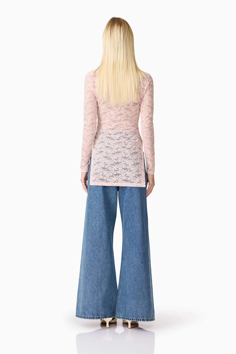 Blonde model wearing CURAAE Armelle Long Sleeve Top in Pink back shot
