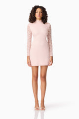 Brunette model wearing CURAAE Armelle Long Sleeve Mini Dress in Pink front shot