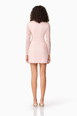 Brunette model wearing CURAAE Armelle Long Sleeve Mini Dress in Pink back shot