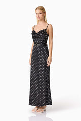 Blonde model wearing Aurellia Cami Top & Skirt Set in Black Polka Dot side shot