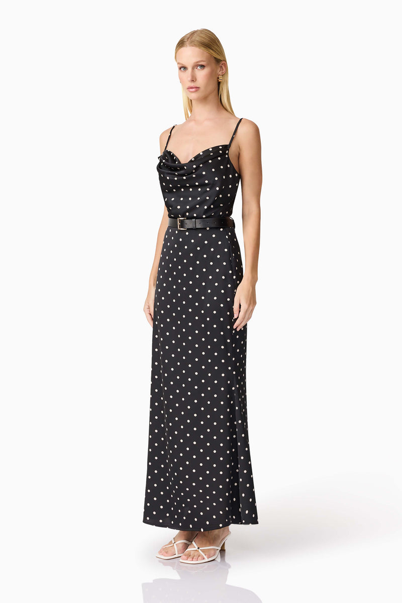 Blonde model wearing Aurellia Cami Top & Skirt Set in Black Polka Dot side shot