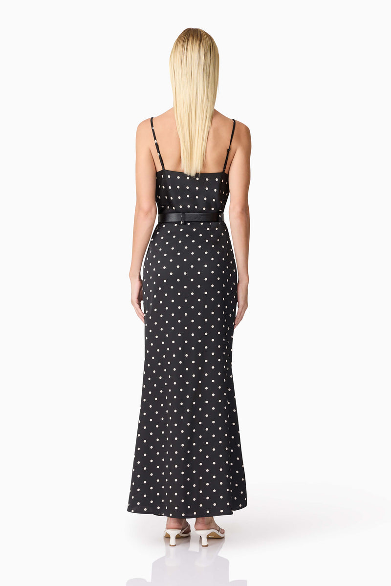 Blonde model wearing Aurellia Cami Top & Skirt Set in Black Polka Dot back shot