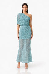 CURAAE Orel Asymmetric Maxi Dress in Blue with draped shoulder design & sheer skirt panel posed front  shot 