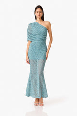 CURAAE Orel Asymmetric Maxi Dress in Blue with draped shoulder design & sheer skirt panel posed hand on hip shot 