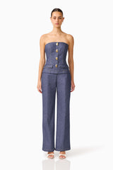CURAAE Vana Denim Jumpsuit in Blue with strapless neckline & front botton detail front shot 