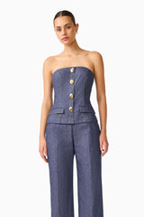 CURAAE Vana Denim Jumpsuit in Blue with strapless neckline & front botton detail close up shot 