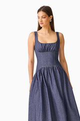 CURAAE Vana Denim Maxi Dress in Blue with scoop neckline & drop waist front close up shot