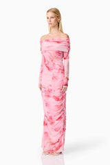 Blonde model wearing CURAAE Rosalia Off The Shoulder Maxi Dress in Pink Floral side shot