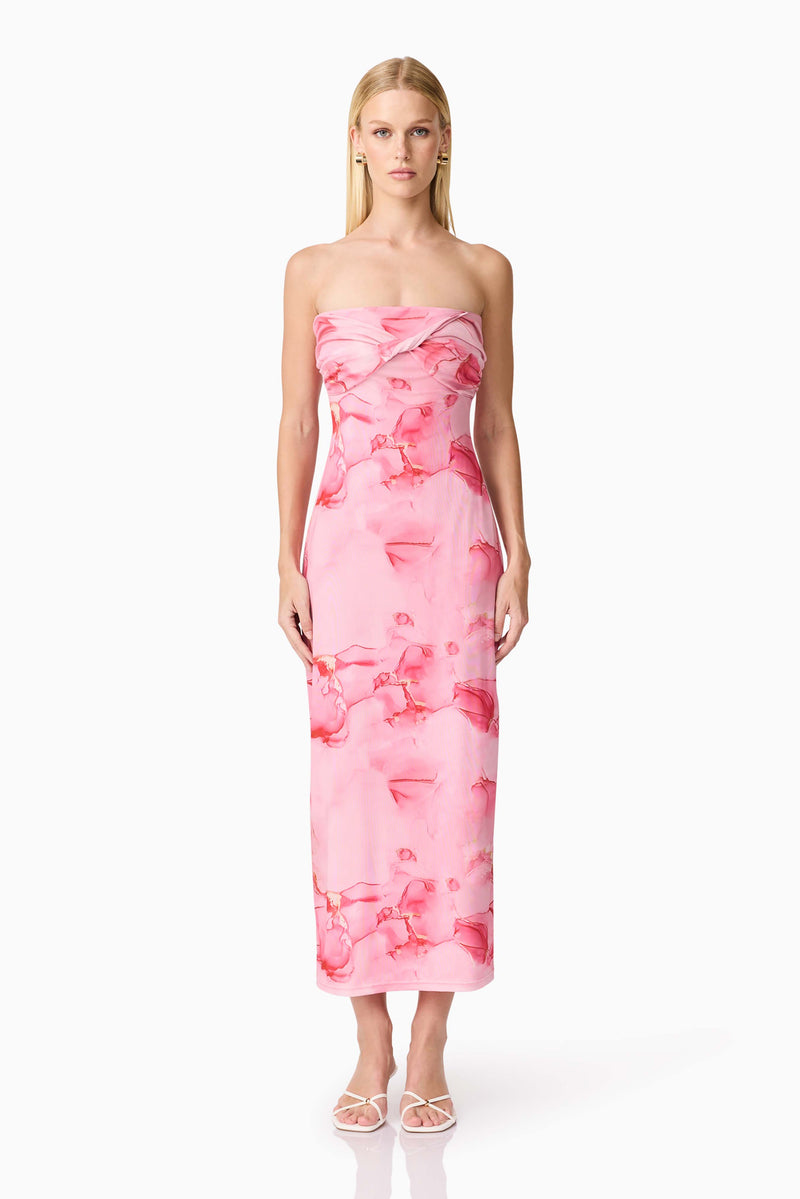 Brunette model wearing CURAAE Rosalia Strapless Midi Dress in Pink Floral front shot