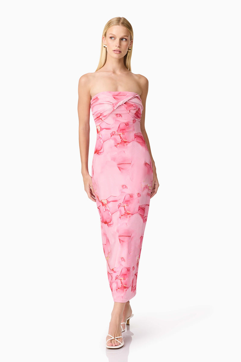 Brunette model wearing CURAAE Rosalia Strapless Midi Dress in Pink Floral posed looking away shot