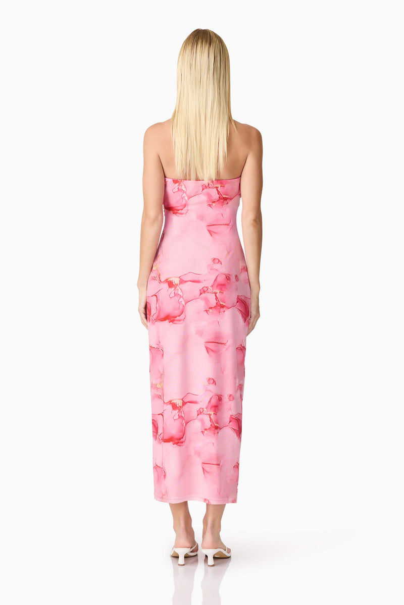 Brunette model wearing CURAAE Rosalia Strapless Midi Dress in Pink Floral back shot