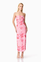 Brunette model wearing CURAAE Rosalia Strapless Midi Dress in Pink Floral posed shot