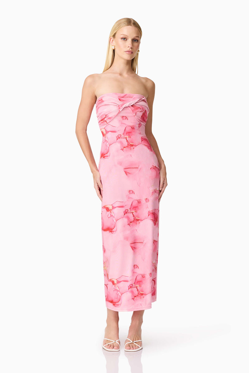 Brunette model wearing CURAAE Rosalia Strapless Midi Dress in Pink Floral posed shot