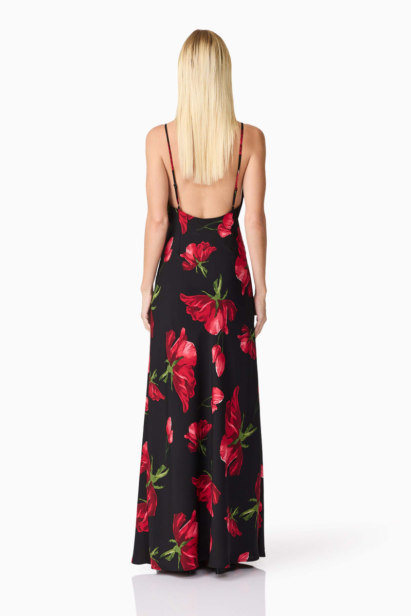 Blonde model wearing CURAAE Valetta Floral Maxi Dress in Black & Red back shot