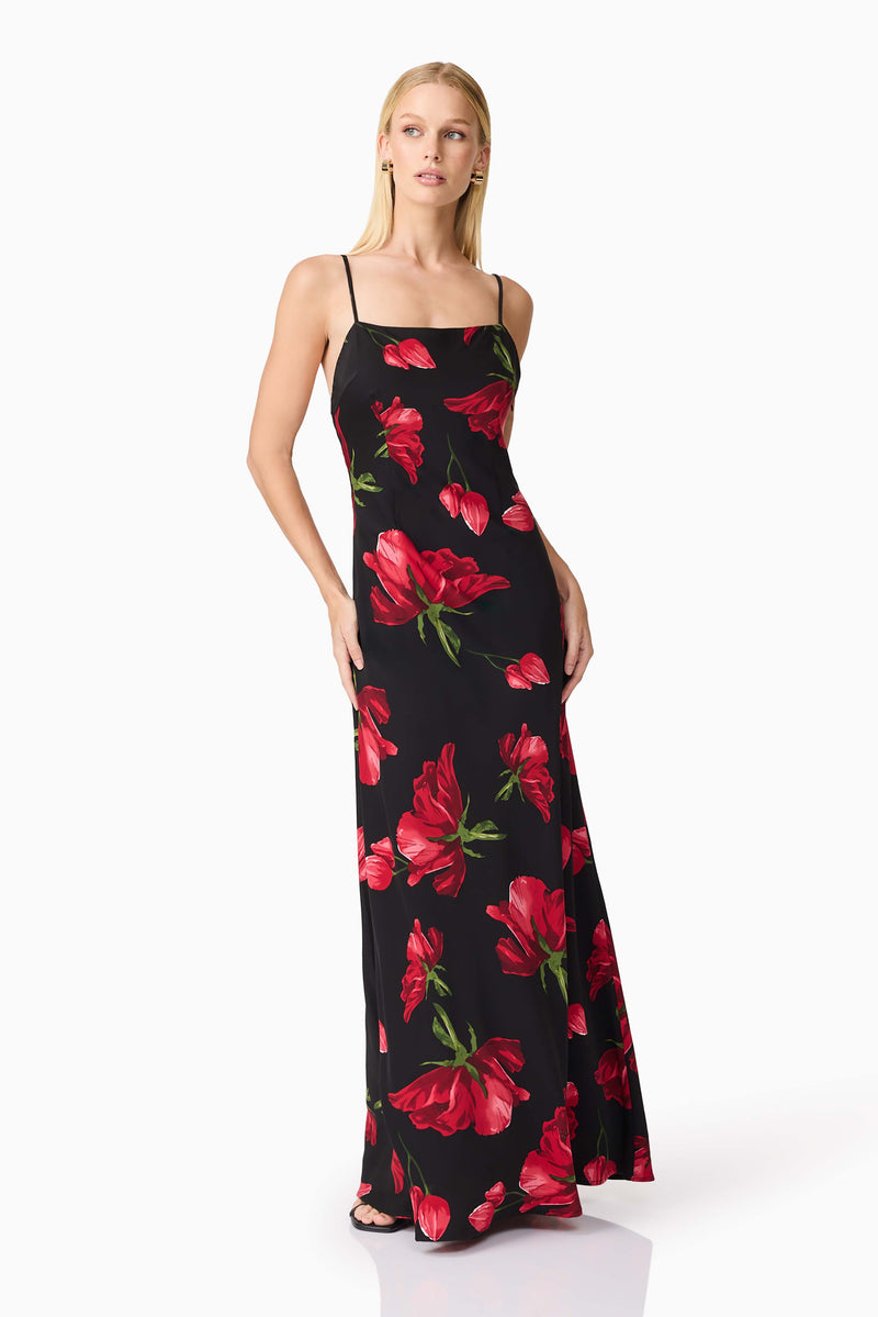 Blonde model wearing CURAAE Valetta Floral Maxi Dress in Black & Red posed looking away shot