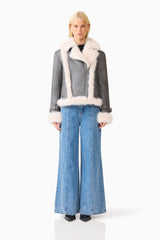 Brunette model wearing the Isolda Jacket in Grey front shot 
